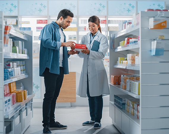 Pharmacist helping customer choose over the counter compression socks.